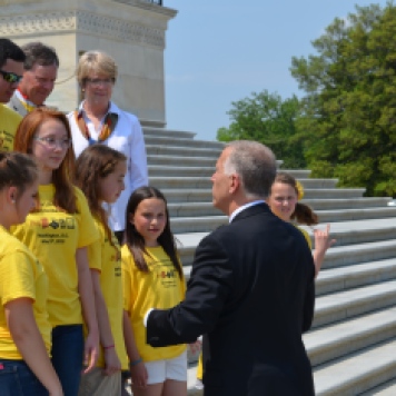 Senator Tillis talks to NCLA's Library Ambassadors on the steps of the US Capitol